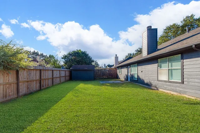 a view of a backyard with a garden