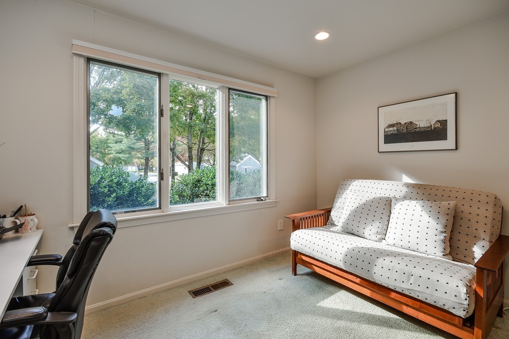 7 Steepletree Lane, Unit 7 Wayland, MA 01778 - Photo 11 of 22 a bedroom with furniture and a window