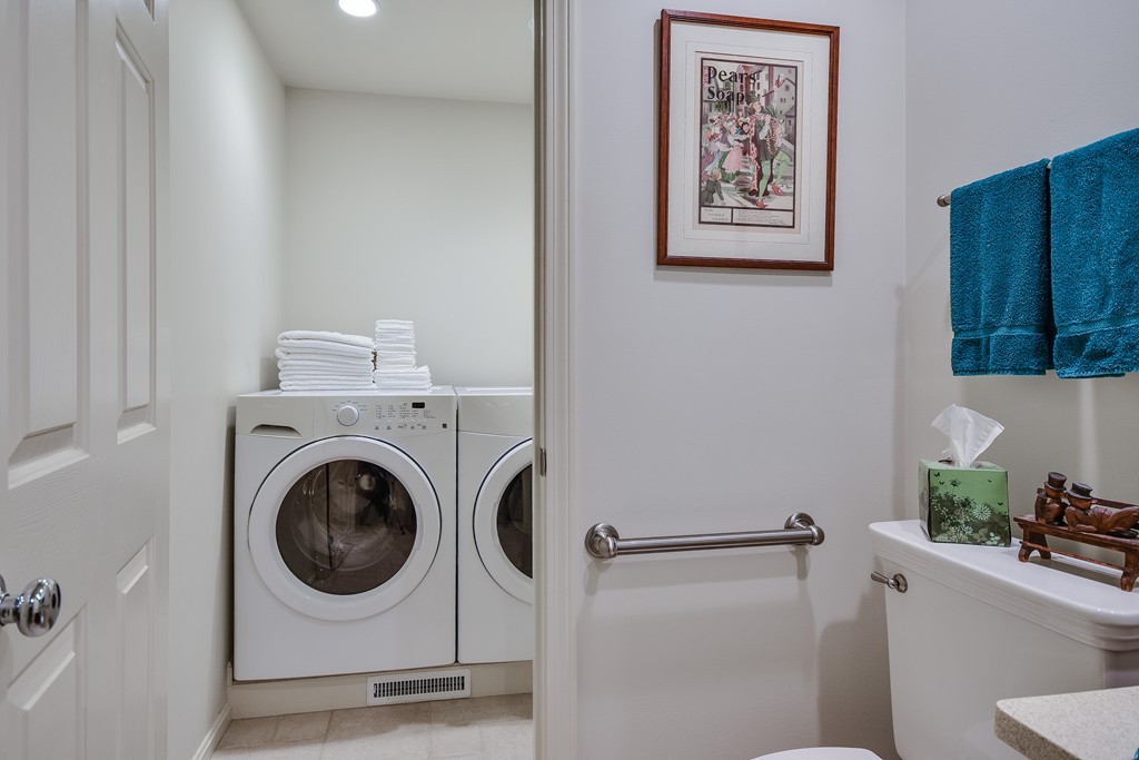 7 Steepletree Lane, Unit 7 Wayland, MA 01778 - Photo 17 of 22 a utility room with dryer and washer