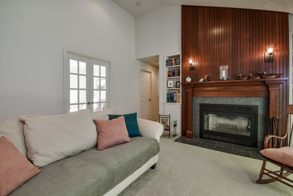 7 Steepletree Lane, Unit 7 Wayland, MA 01778 - Photo 8 of 22 a living room with furniture and a fireplace