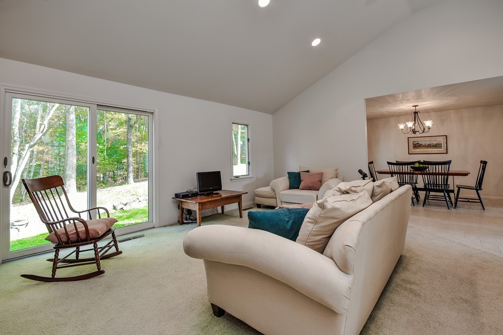 7 Steepletree Lane, Unit 7 Wayland, MA 01778 - Photo 9 of 22 a living room with furniture and floor to ceiling windows