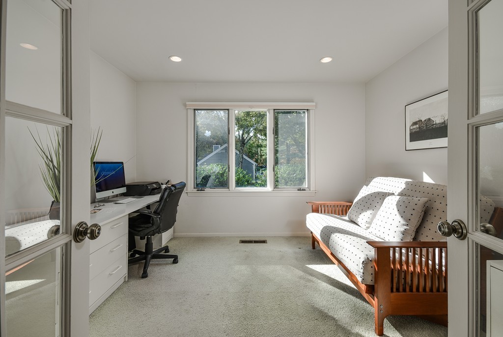 7 Steepletree Lane, Unit 7 Wayland, MA 01778 - Photo 10 of 22 a living room with furniture and a window