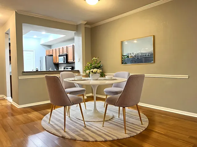 a view of a dining room with furniture and wooden floor