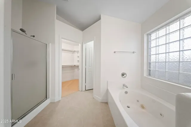 a bathroom with a bathtub and a shower