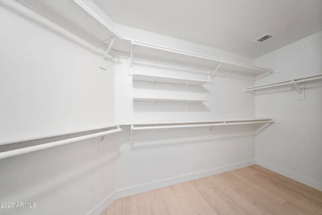 a view of an empty walk in closet