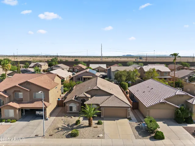 an aerial view of a house with a garden