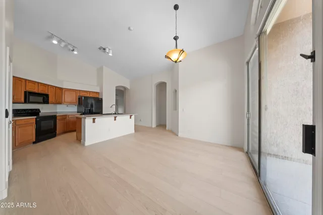 a view of a kitchen with microwave and cabinets