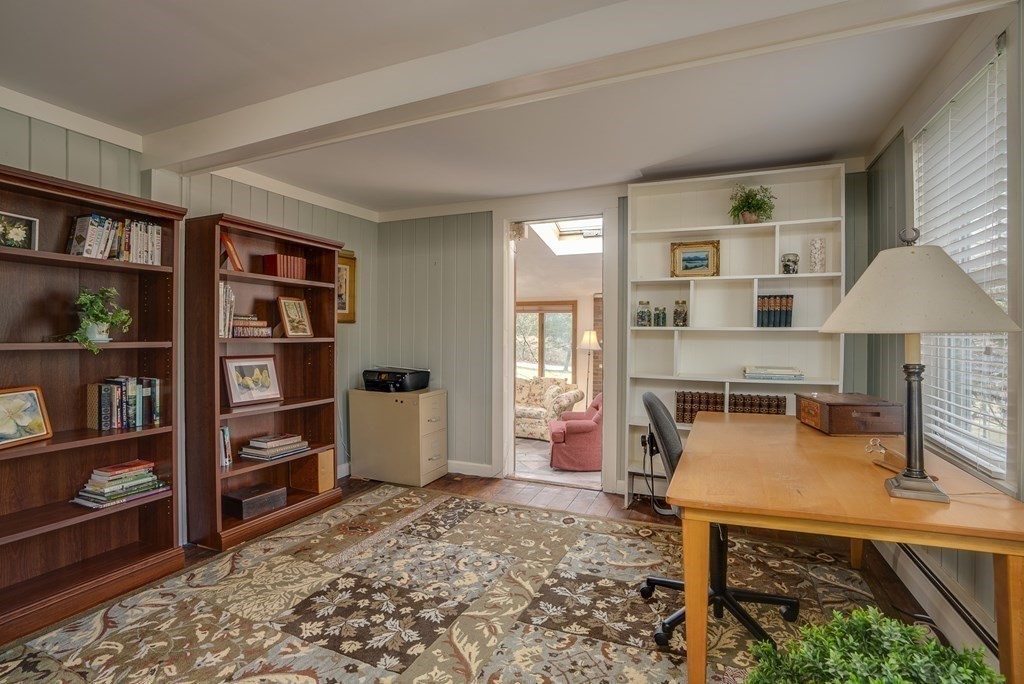 35 Wilson Road Bedford, MA 01730 - Photo 18 of 42 a living room with furniture and a book shelf