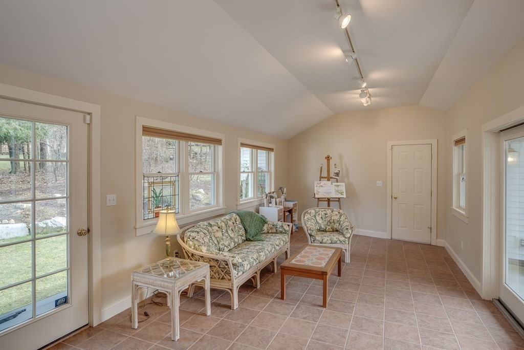 35 Wilson Road Bedford, MA 01730 - Photo 21 of 42 a living room with furniture and a large window