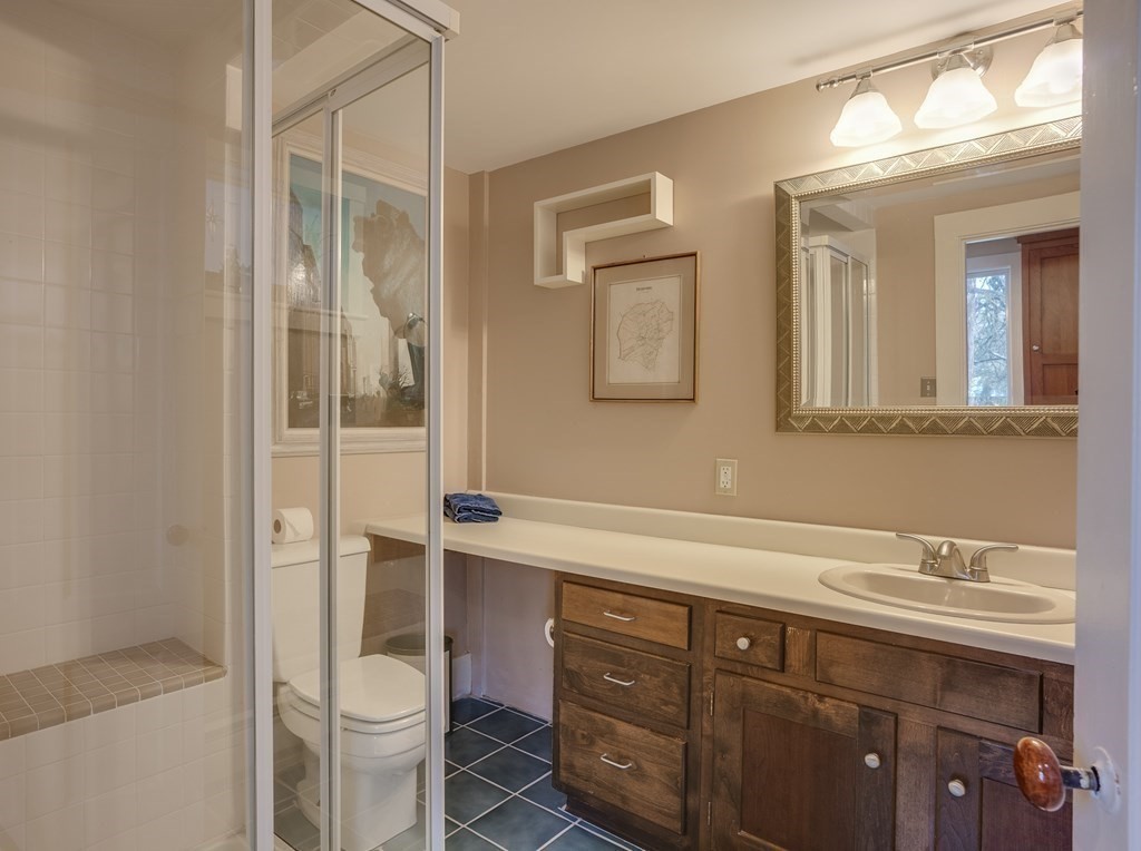 35 Wilson Road Bedford, MA 01730 - Photo 23 of 42 a bathroom with a sink a toilet and shower