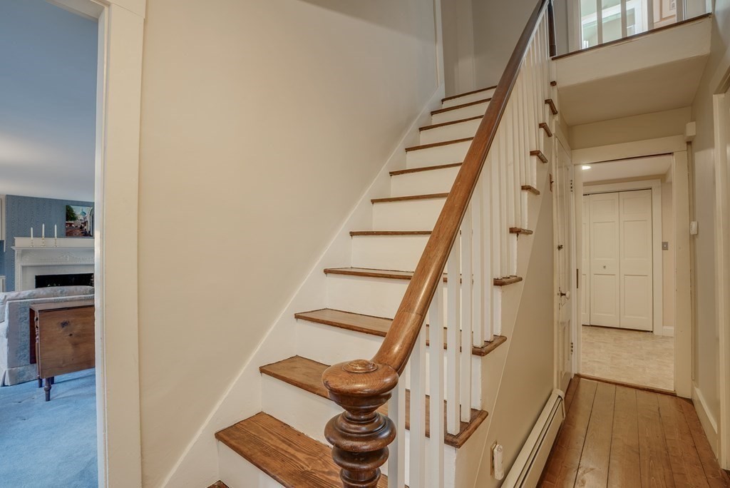 35 Wilson Road Bedford, MA 01730 - Photo 24 of 42 a view of entryway with wooden floor and stairs