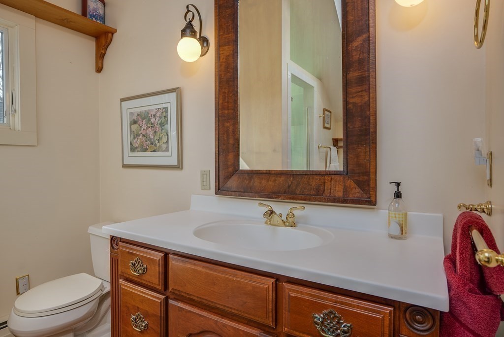 35 Wilson Road Bedford, MA 01730 - Photo 33 of 42 a bathroom with a toilet sink and mirror