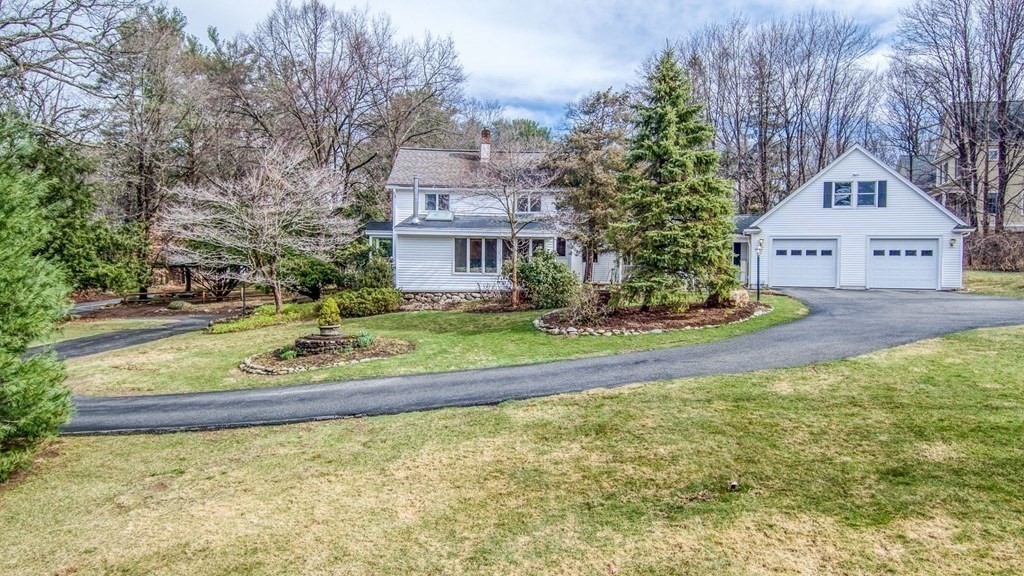 35 Wilson Road Bedford, MA 01730 - Photo 36 of 42 a front view of a house with a yard