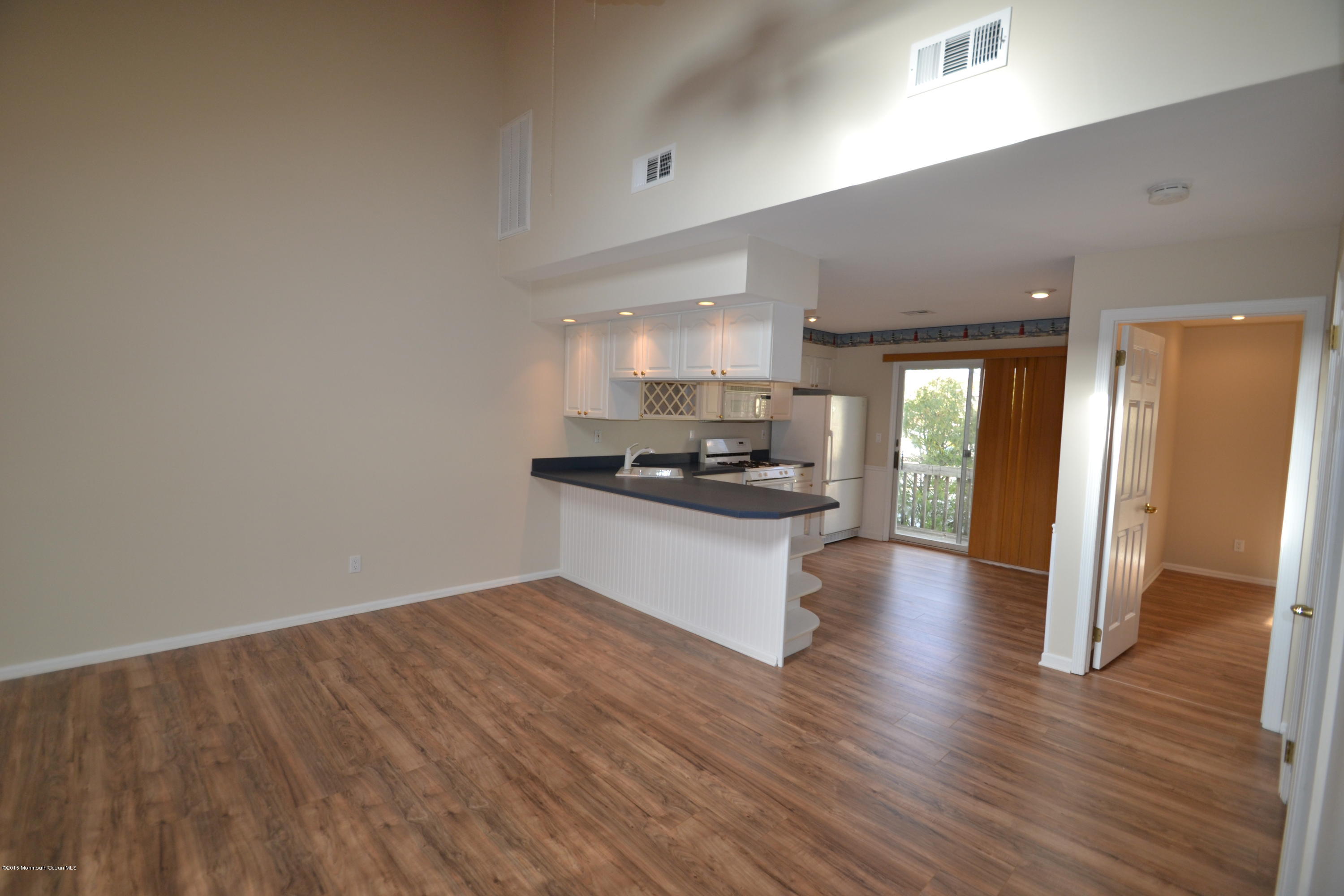 1212 Beaver Dam Road, Unit 14 Point Pleasant, NJ 08742 - Photo 3 of 14 a view of kitchen with sink and wooden floor