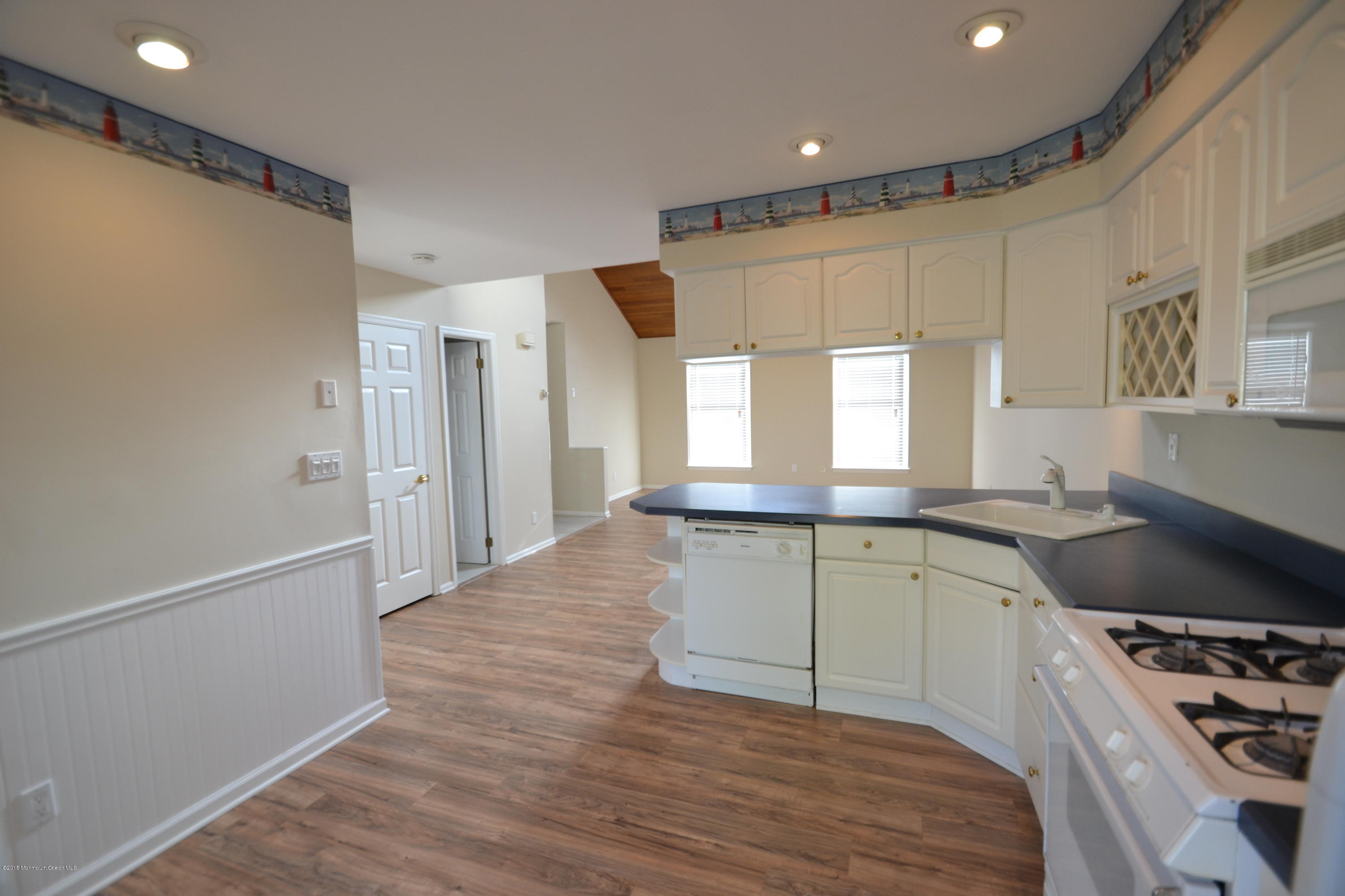1212 Beaver Dam Road, Unit 14 Point Pleasant, NJ 08742 - Photo 8 of 14 a kitchen with a sink stove and refrigerator