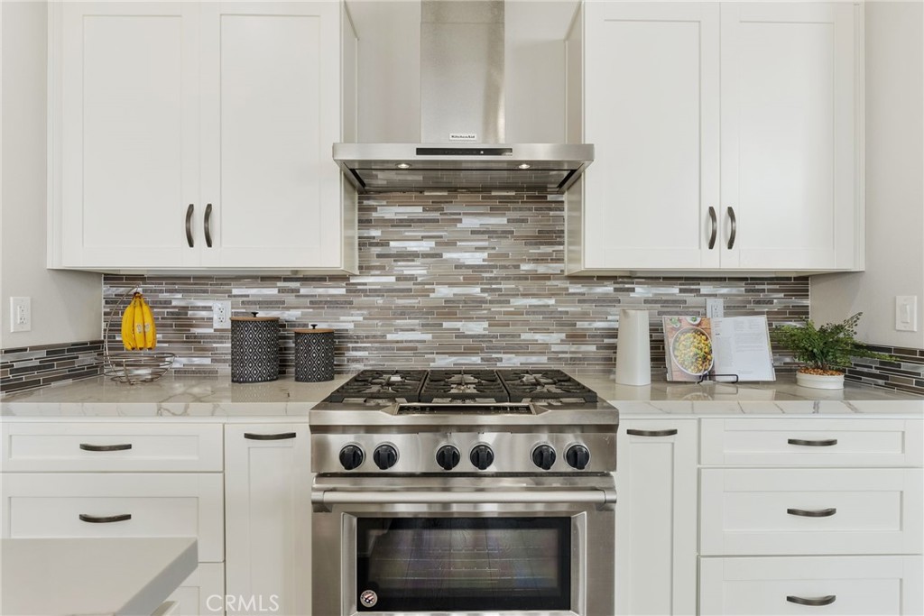 29632 Alta Terra Laguna Niguel, CA 92677 - Photo 15 of 37 a stove top oven sitting inside of a kitchen