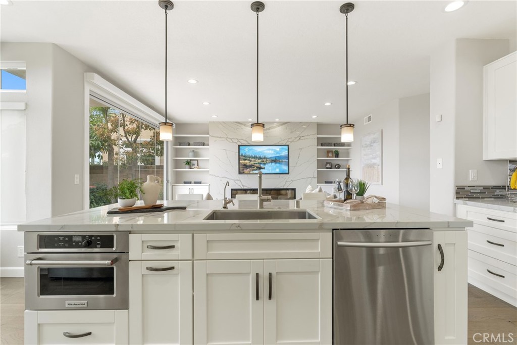 29632 Alta Terra Laguna Niguel, CA 92677 - Photo 2 of 37 a kitchen with stainless steel appliances granite countertop a sink a stove a refrigerator and a wooden floor