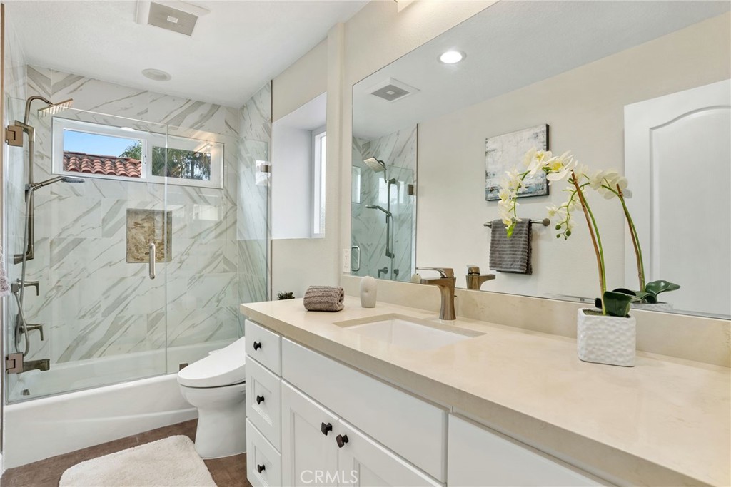 29632 Alta Terra Laguna Niguel, CA 92677 - Photo 21 of 37 a bathroom with a sink a toilet and shower