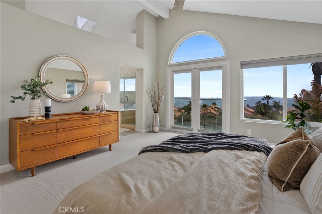 29632 Alta Terra Laguna Niguel, CA 92677 - Photo 23 of 37 a bedroom with a bed mirror and a large window