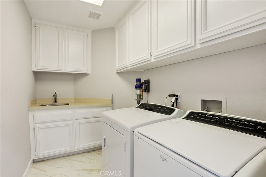 29632 Alta Terra Laguna Niguel, CA 92677 - Photo 29 of 37 a utility room with dryer and washer