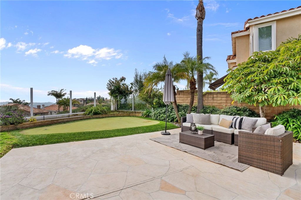 29632 Alta Terra Laguna Niguel, CA 92677 - Photo 35 of 37 a view of a backyard with couches plants and palm trees