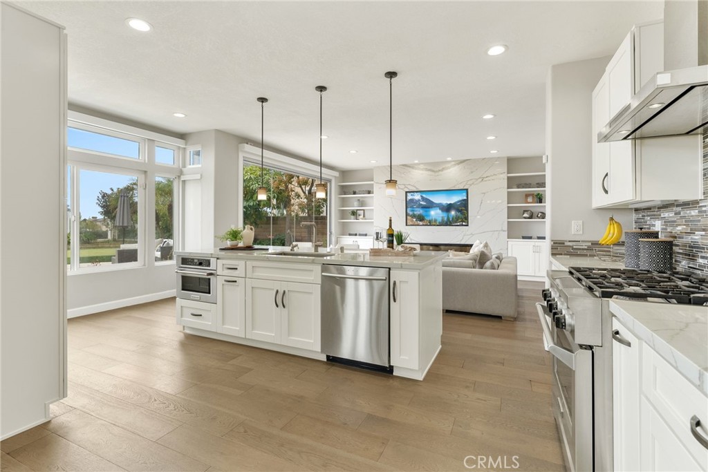 29632 Alta Terra Laguna Niguel, CA 92677 - Photo 5 of 37 a kitchen with white cabinets and stainless steel appliances