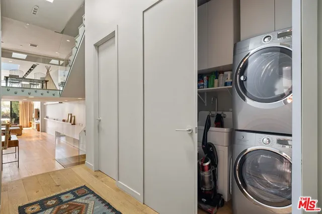 a view of a kitchen with washer and dryer