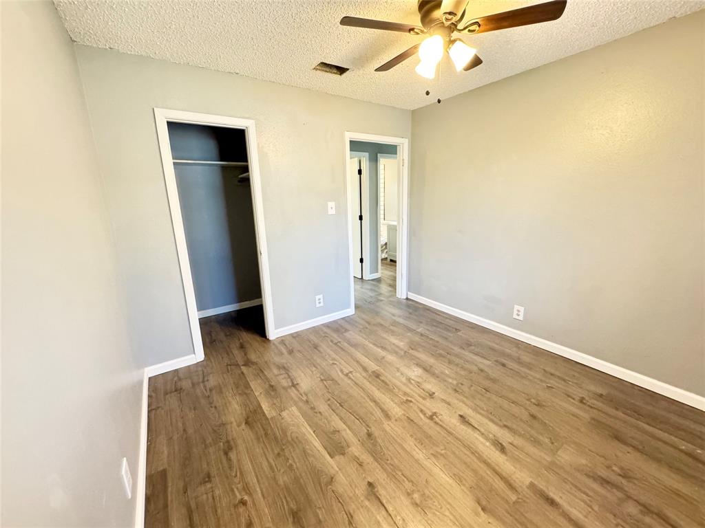 51 County Road Paris, TX 75460 - Photo 11 of 16 wooden floor in an empty room with a window