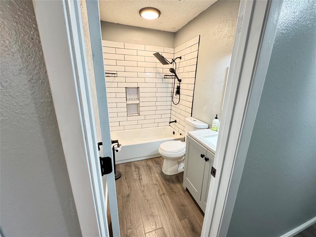 51 County Road Paris, TX 75460 - Photo 13 of 16 a bathroom with a granite countertop shower toilet and a sink