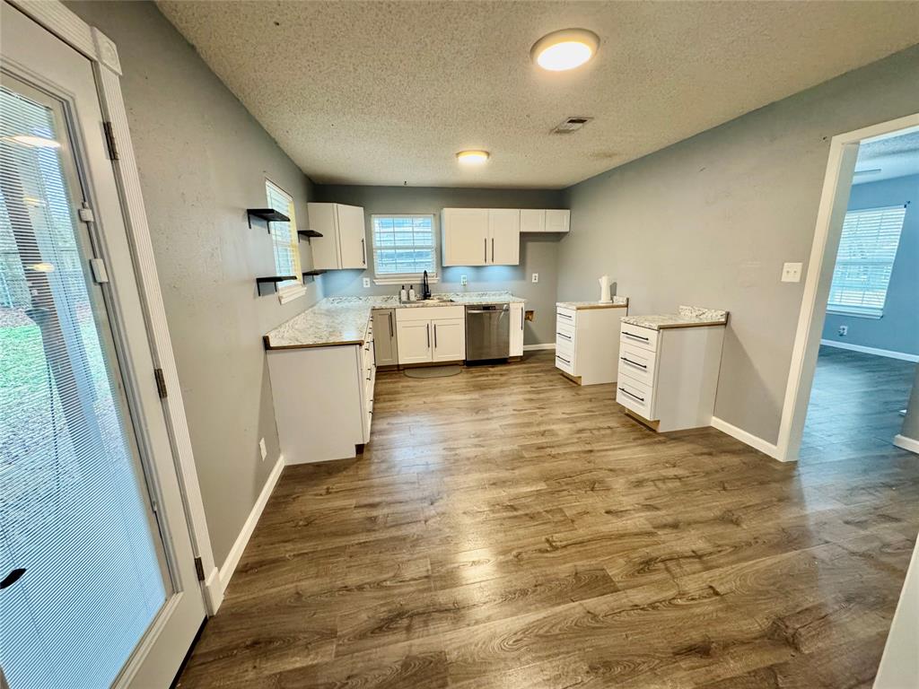 51 County Road Paris, TX 75460 - Photo 6 of 16 a view of a kitchen with wooden floor and electronic appliances