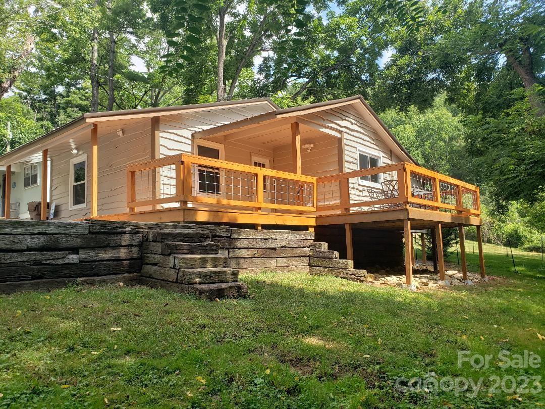 45 Mountainside Circle Maggie Valley, NC 28751 - Photo 1 of 13 a front view of a house with a yard