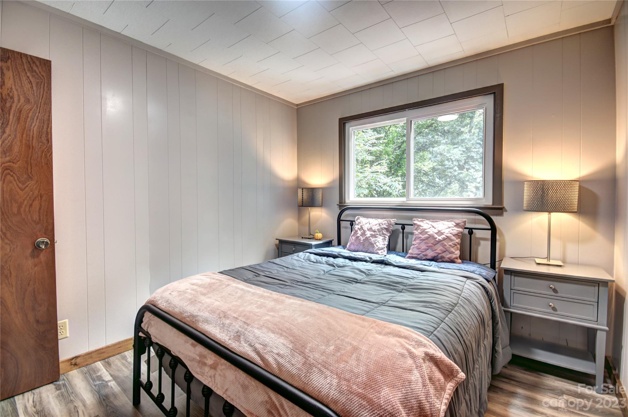 45 Mountainside Circle Maggie Valley, NC 28751 - Photo 11 of 13 a bedroom with a bed and a window