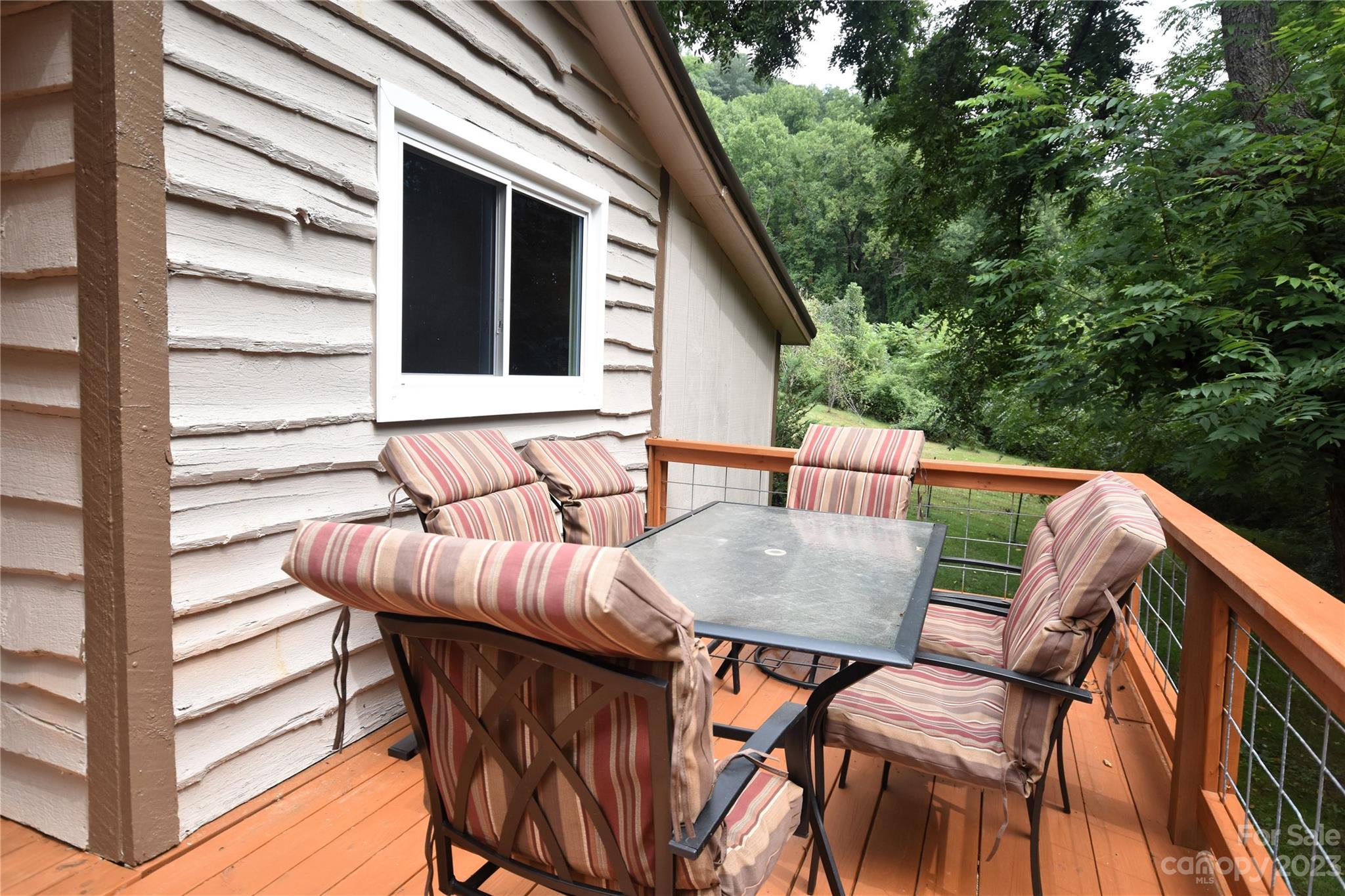 45 Mountainside Circle Maggie Valley, NC 28751 - Photo 4 of 13 a view of balcony with wooden floor and outdoor seating