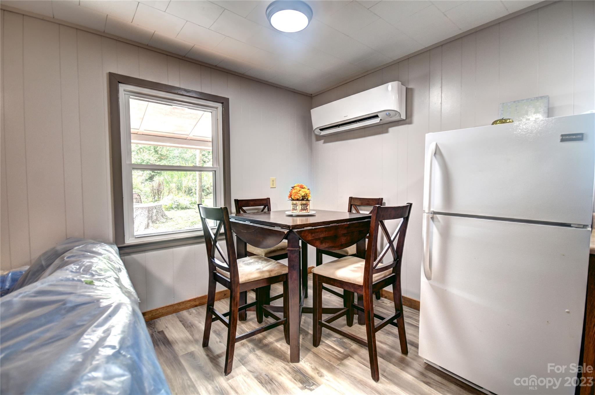 45 Mountainside Circle Maggie Valley, NC 28751 - Photo 7 of 13 a view of a dining room with furniture window and wooden floor