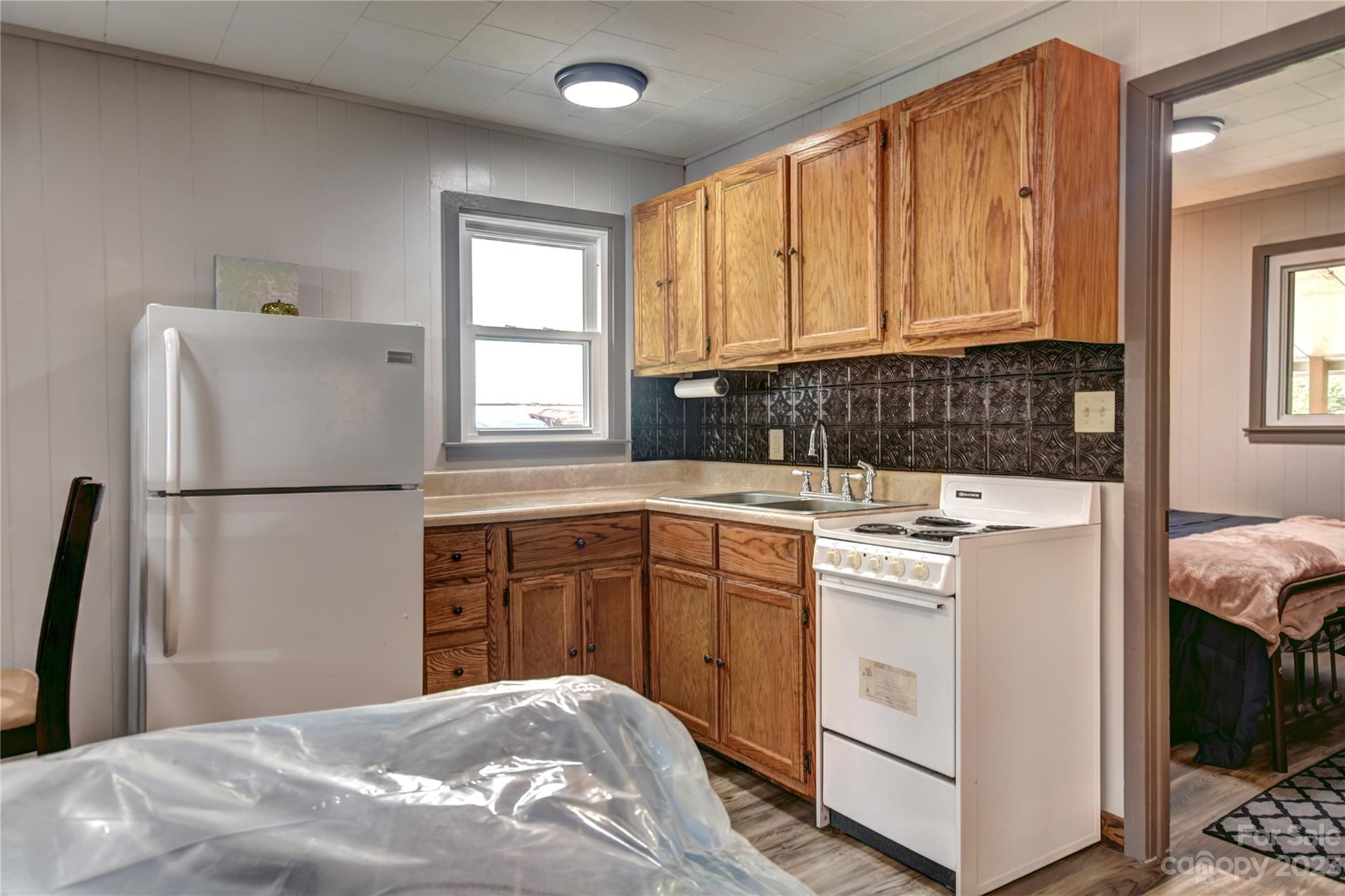 45 Mountainside Circle Maggie Valley, NC 28751 - Photo 8 of 13 a kitchen with a refrigerator sink and cabinets