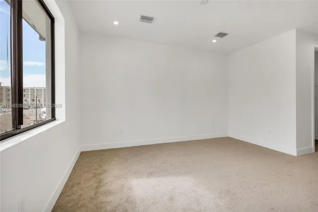 a view of a bathroom from a hallway