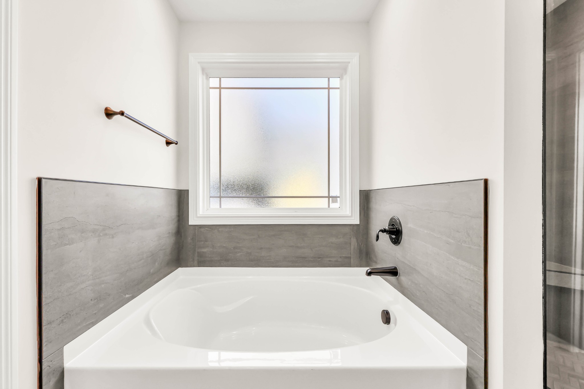 864 Burley Barn Road Clarksville, TN 37042 - Photo 11 of 24 a white bath tub sitting in a bathroom