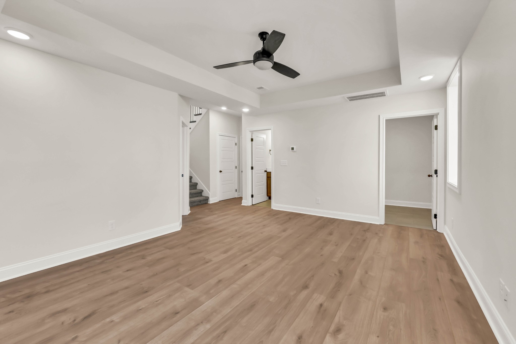 864 Burley Barn Road Clarksville, TN 37042 - Photo 18 of 24 a view of an empty room and wooden floor