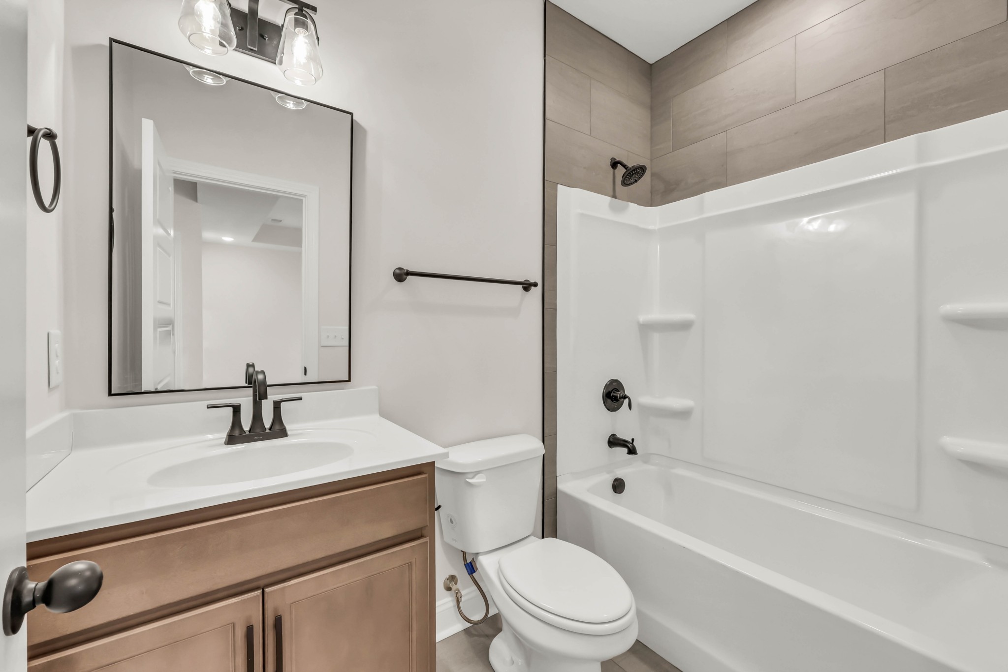 864 Burley Barn Road Clarksville, TN 37042 - Photo 20 of 24 a bathroom with a sink a toilet a mirror a vanity and shower