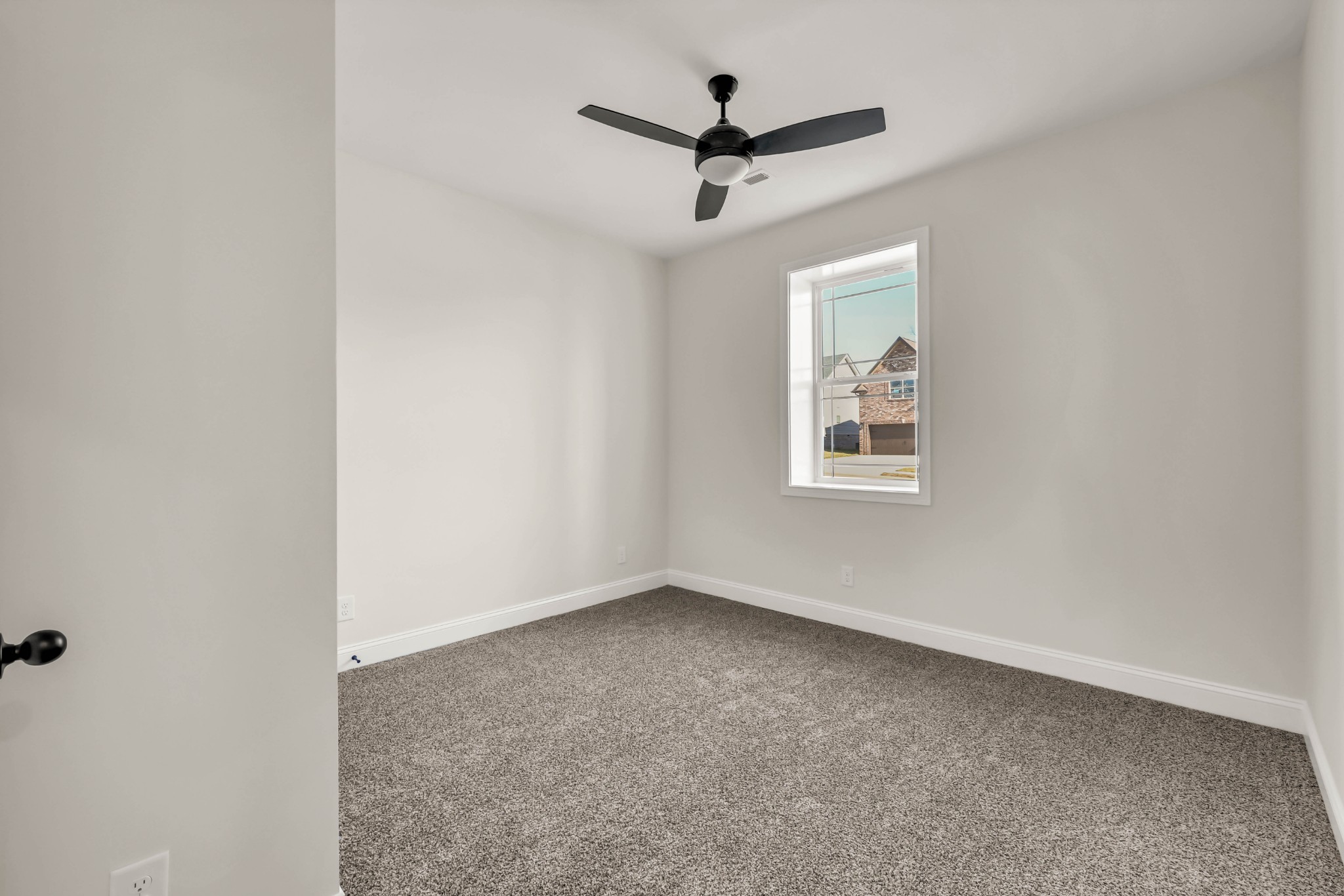 864 Burley Barn Road Clarksville, TN 37042 - Photo 21 of 24 an empty room with a window and a ceiling fan