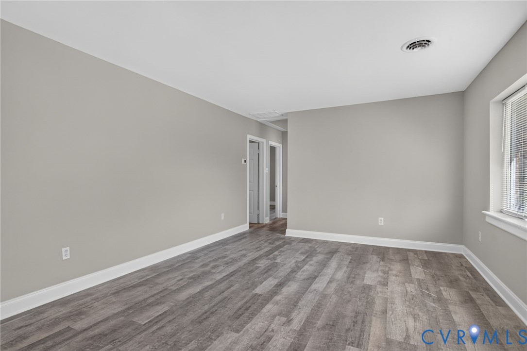 1118 Andros Road Richmond, VA 23225 - Photo 5 of 28 new LVP flooring, light grey wall paint, and white