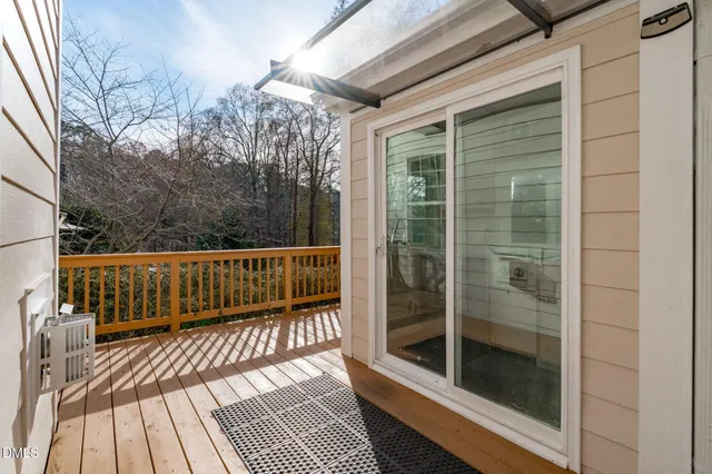 a view of balcony with small yard