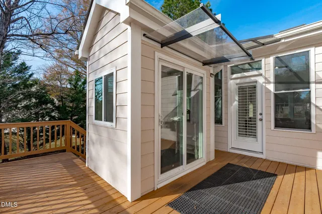 a view of a balcony with wooden floor