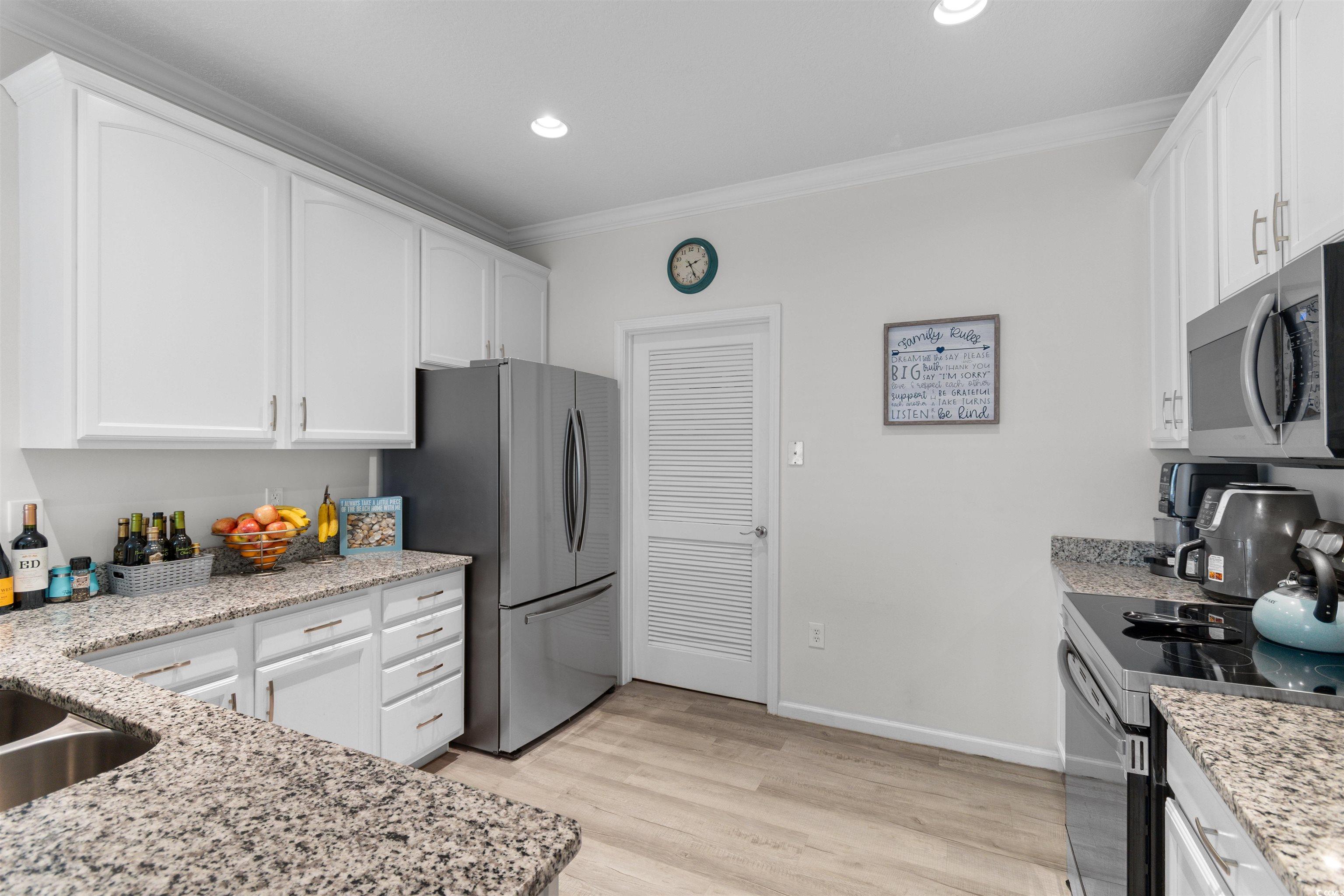 Kitchen with appliances with stainless steel finis