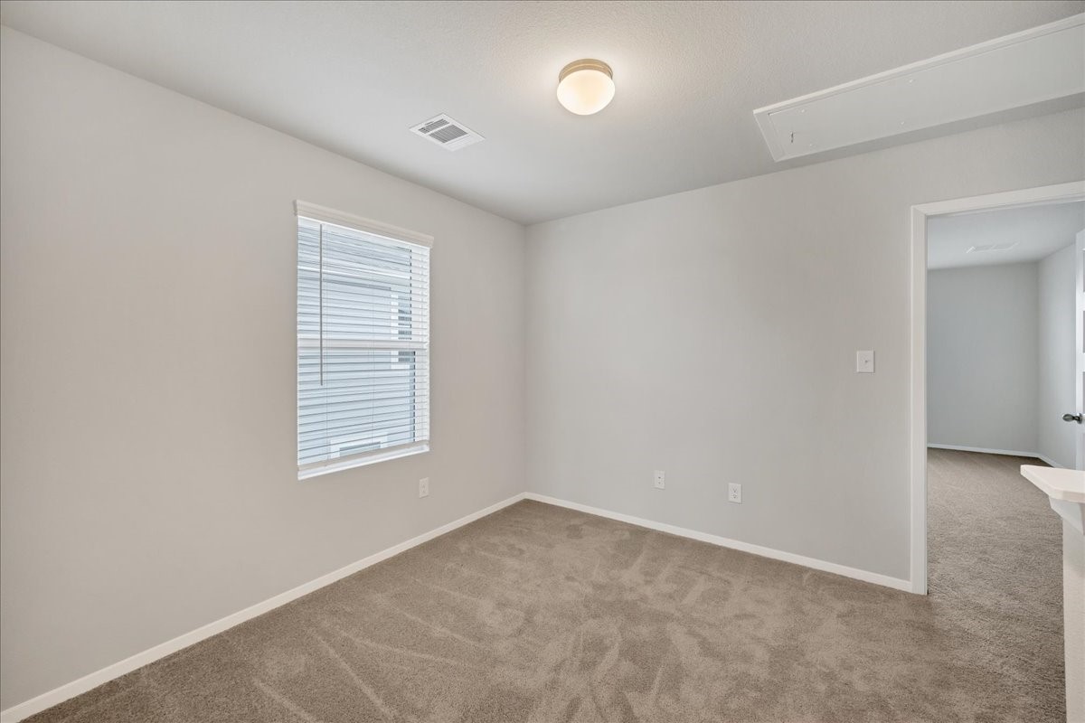 116 Honeybee Lane Elgin, TX 78621 - Photo 18 of 37 an empty room with windows