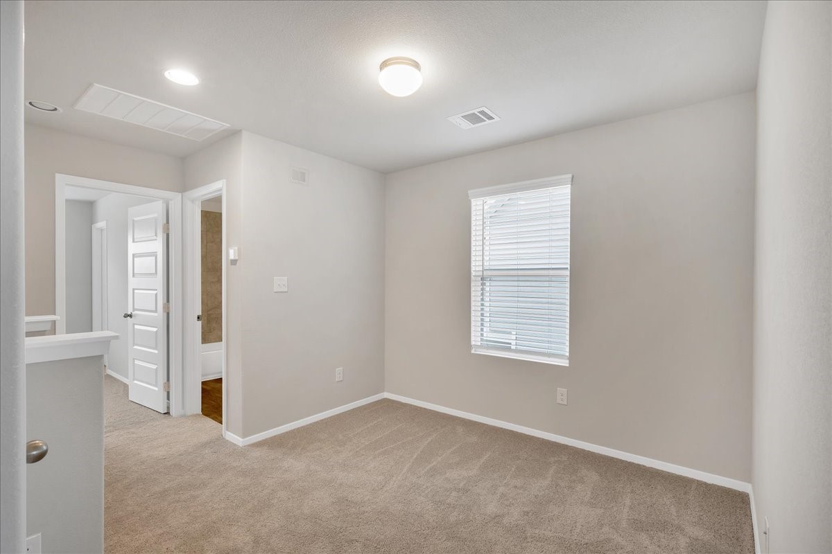 116 Honeybee Lane Elgin, TX 78621 - Photo 19 of 37 an empty room with windows