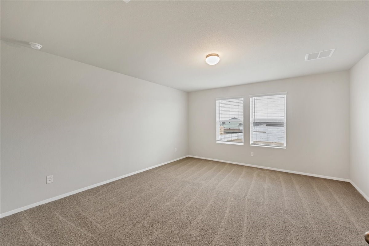 116 Honeybee Lane Elgin, TX 78621 - Photo 20 of 37 an empty room with a window