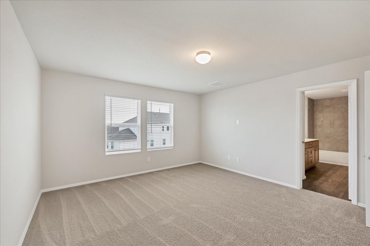 116 Honeybee Lane Elgin, TX 78621 - Photo 21 of 37 an empty room with windows and closet