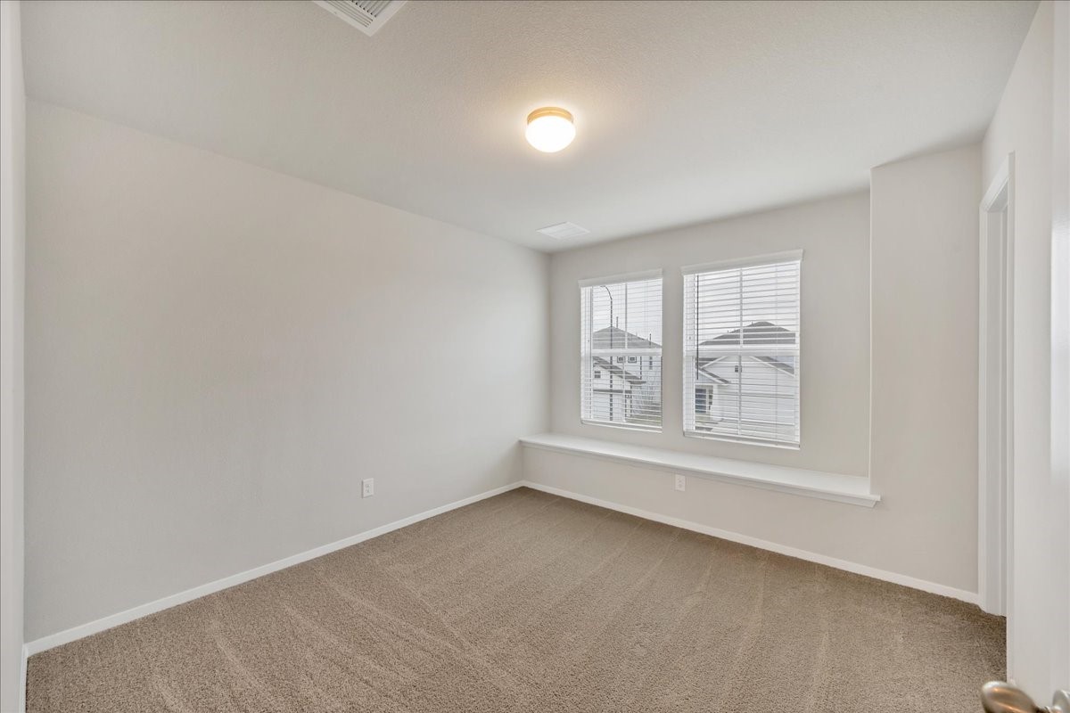 116 Honeybee Lane Elgin, TX 78621 - Photo 26 of 37 an empty room with a window