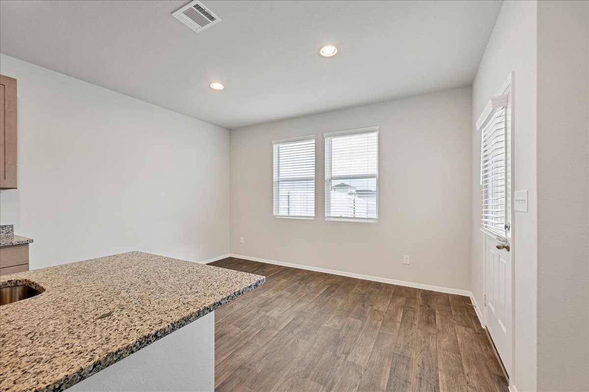 116 Honeybee Lane Elgin, TX 78621 - Photo 30 of 37 an empty room with wooden floor